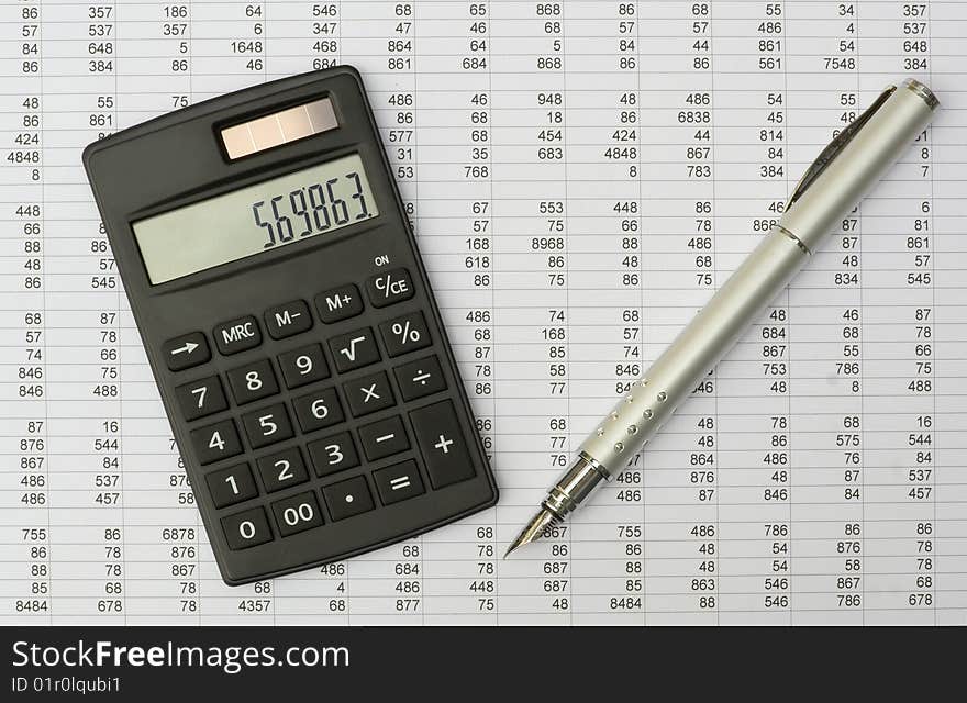 Calculator and pen on a white background. Calculator and pen on a white background