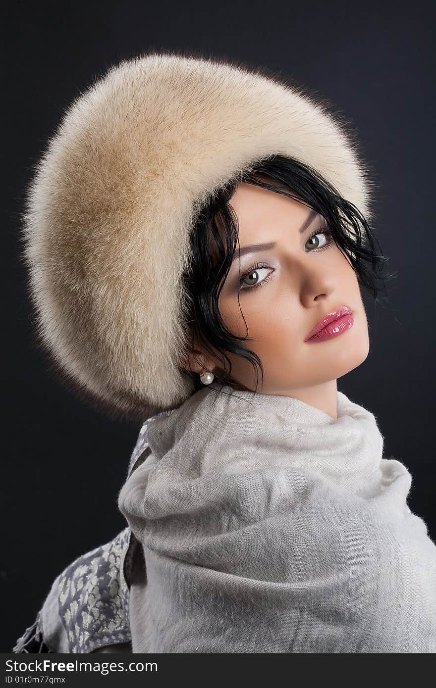 Young attractive woman in a fur hat