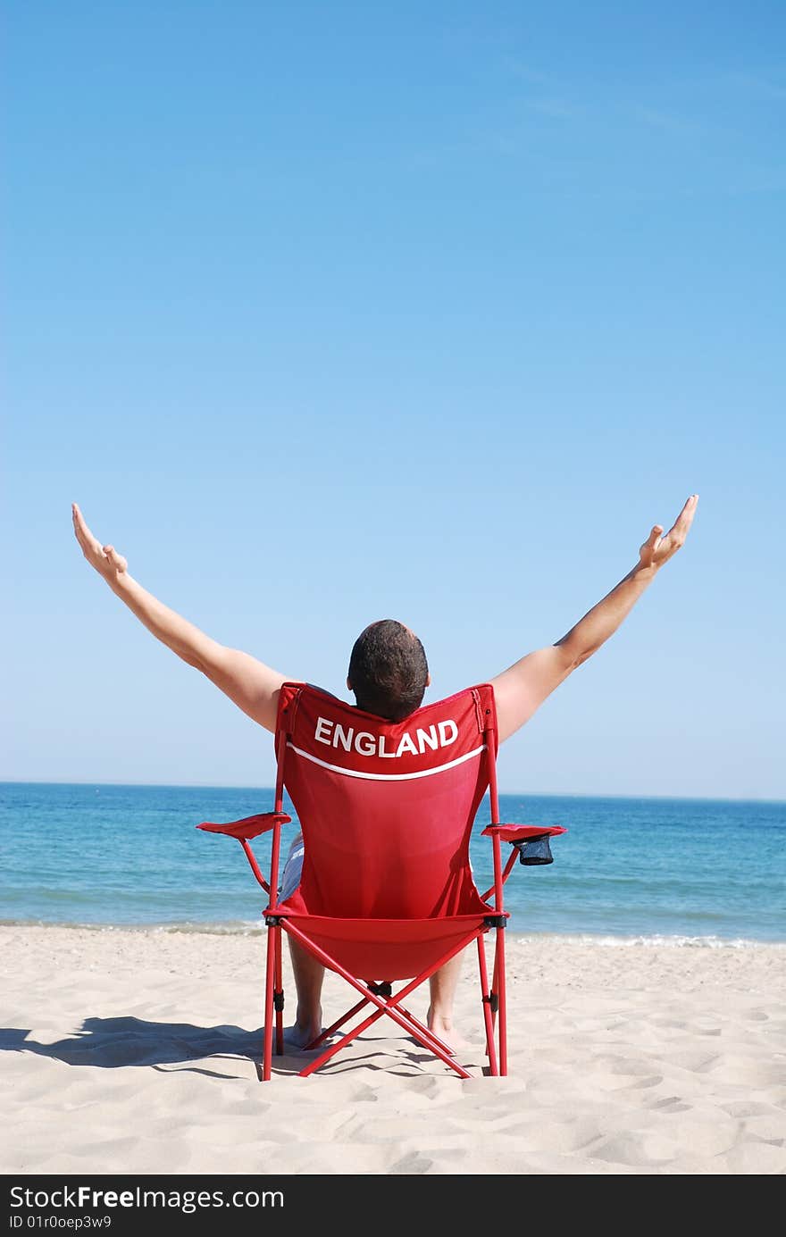 Man relaxing on sunbed at the beach. Man relaxing on sunbed at the beach