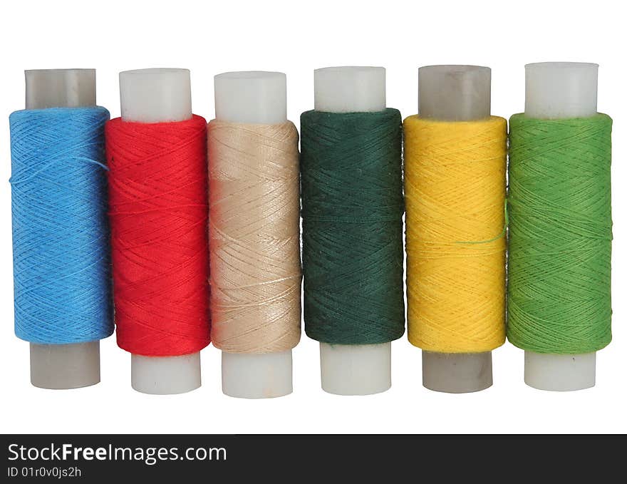 Set of colour threads for sewing on a white background