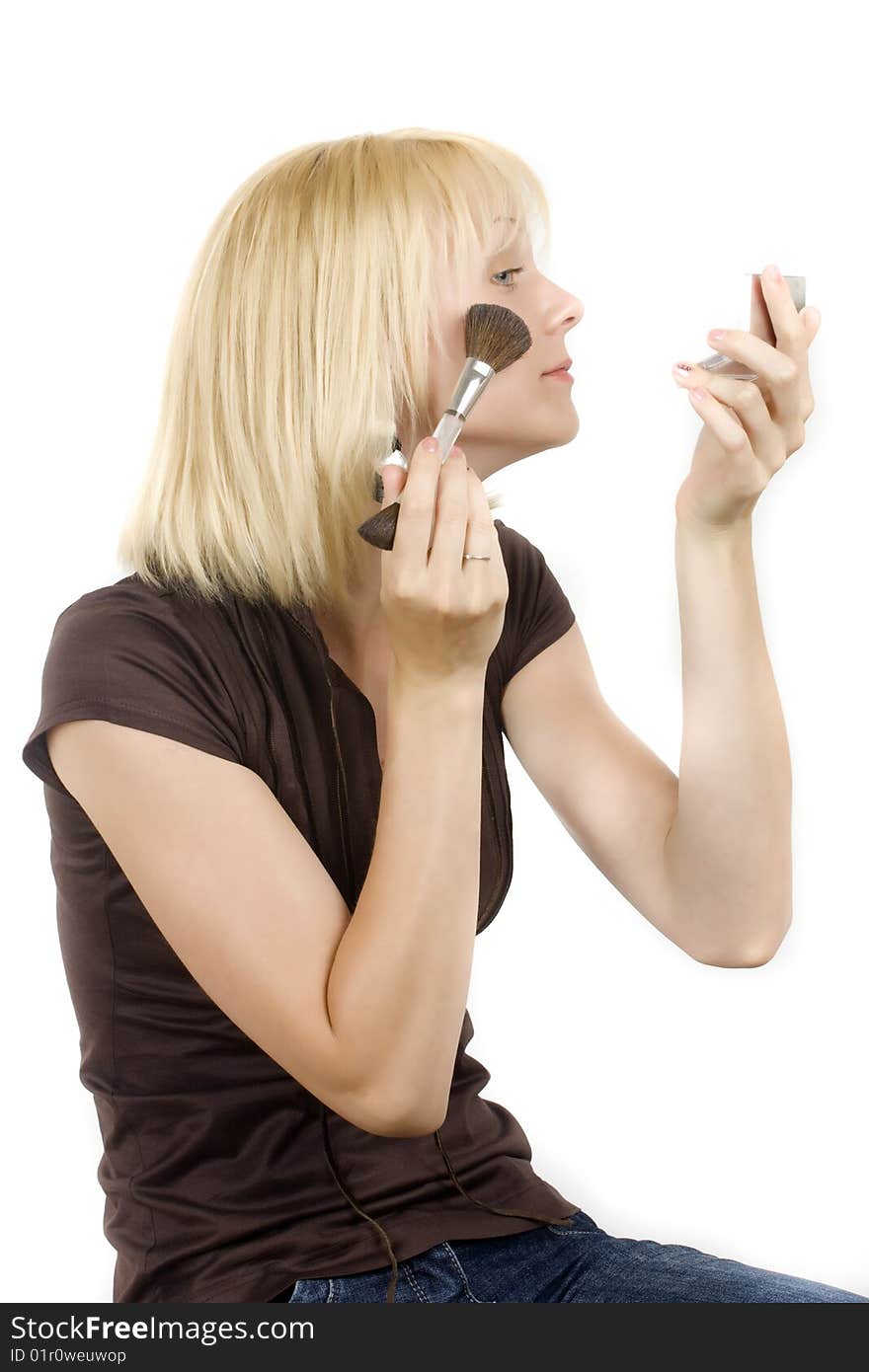 Portrait of the beautiful girl putting on makeup. Portrait of the beautiful girl putting on makeup