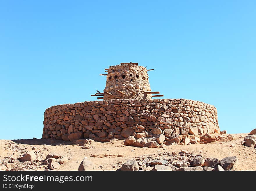 Stone pigeon house in Arabian desert, Egypt