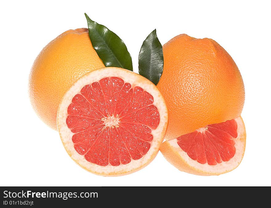 Fresh grapefruits with leafs on white background