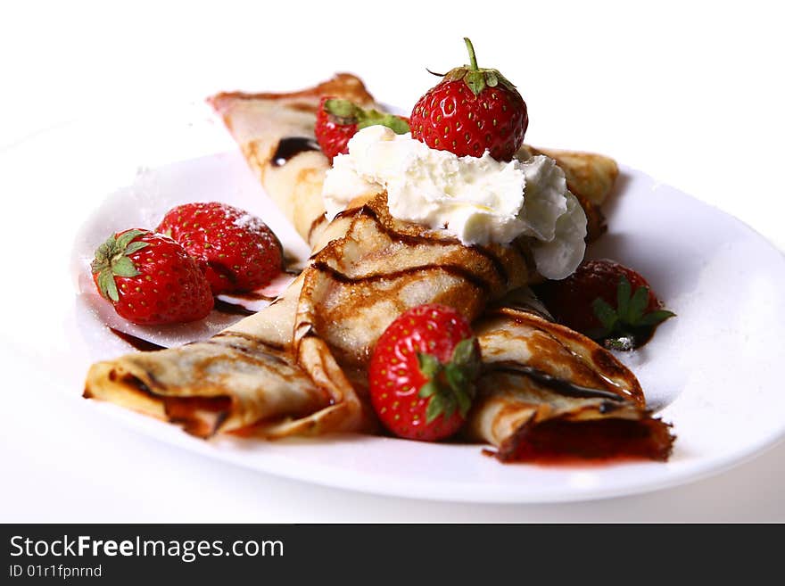 Dessert plate witn pancakes and strawberry