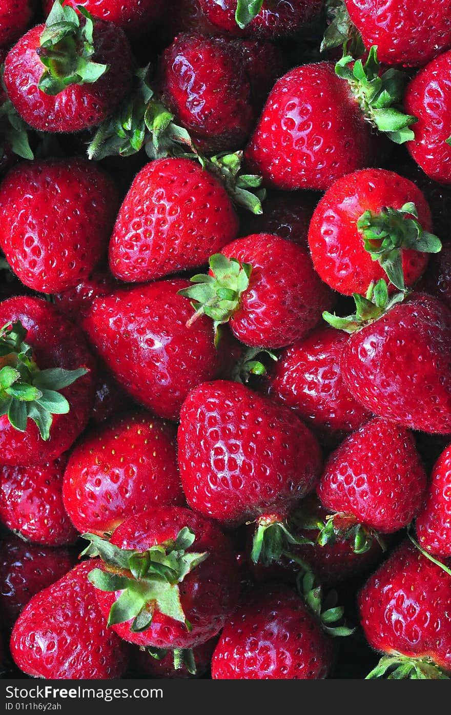 Vertical shot of fresh local strawberries. Vertical shot of fresh local strawberries