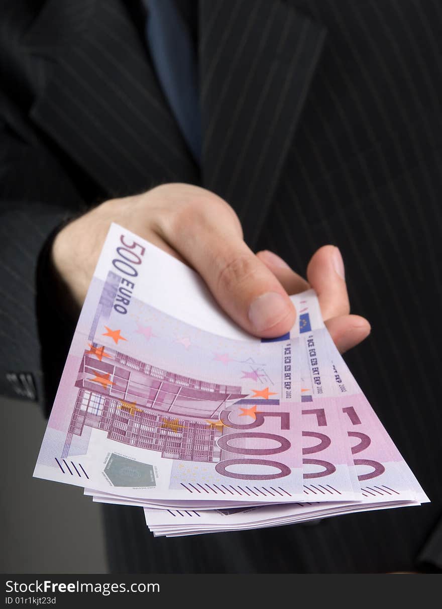 Businessman holding euros