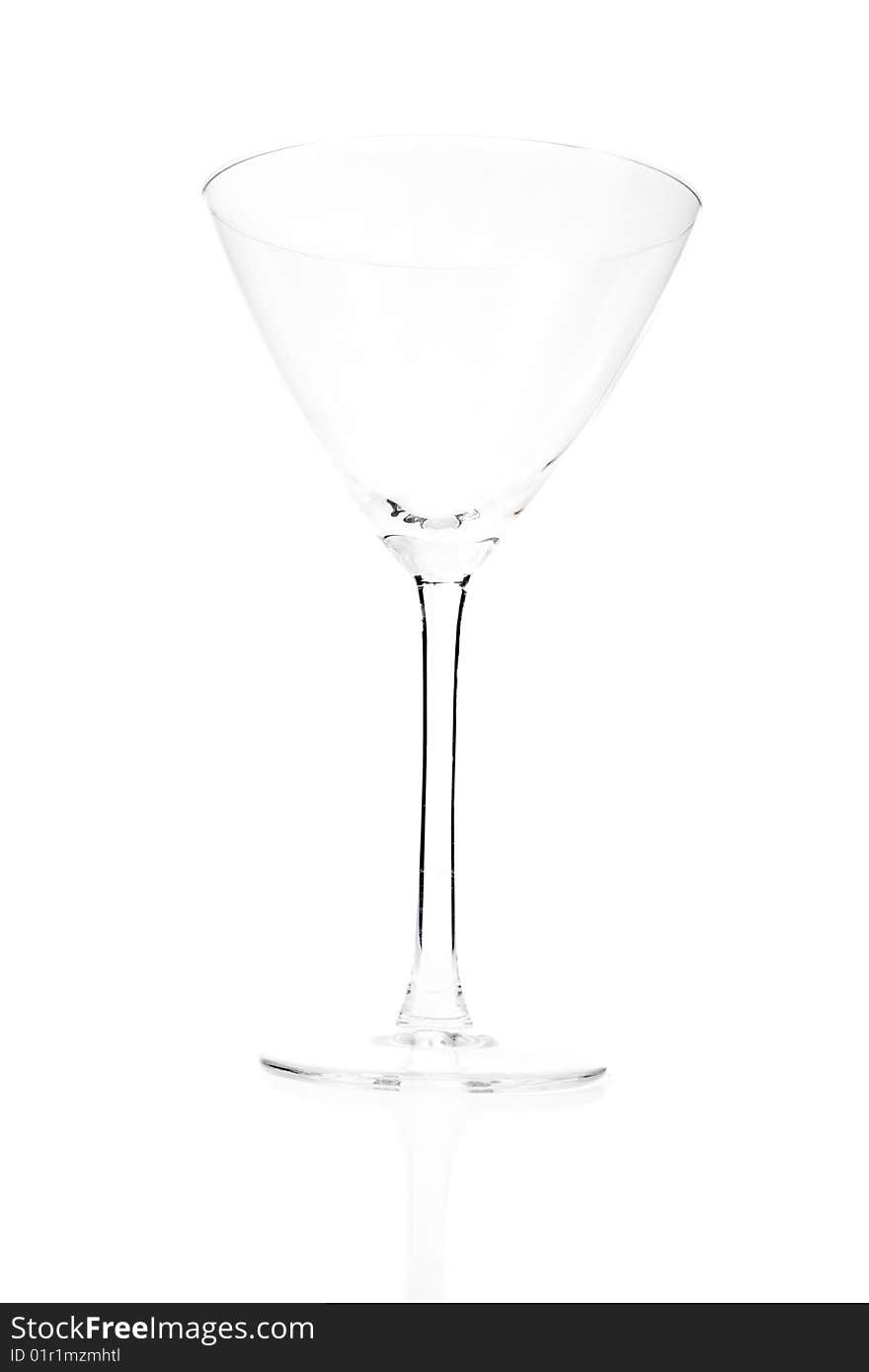 Empty cocktail glass on white ground