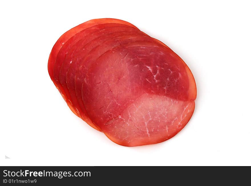 Slices of ham isolated on white background