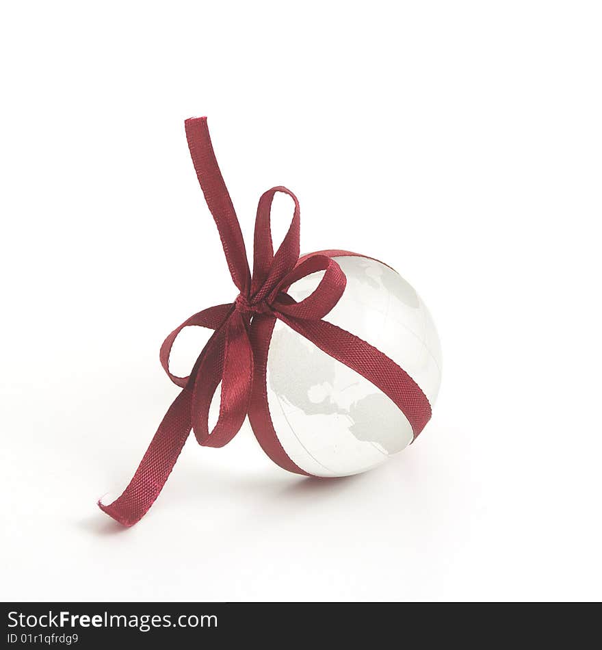 Glass globe and red ribbon. Glass globe and red ribbon