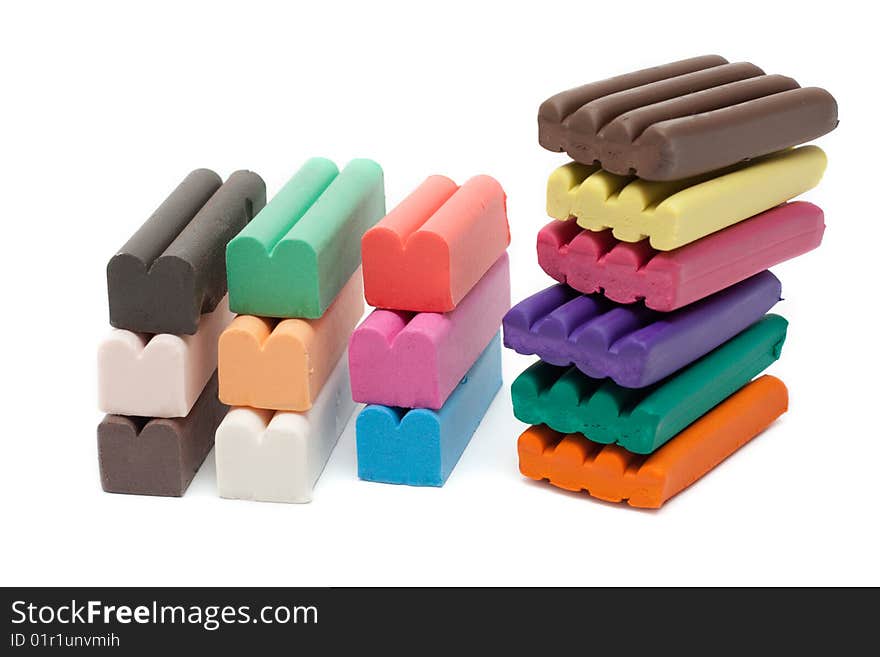 Multicolour piles plasticine insulated on white background