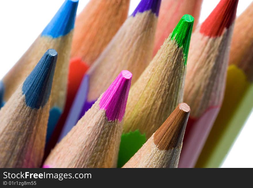 Close up of colored pencils over white background. Isolated