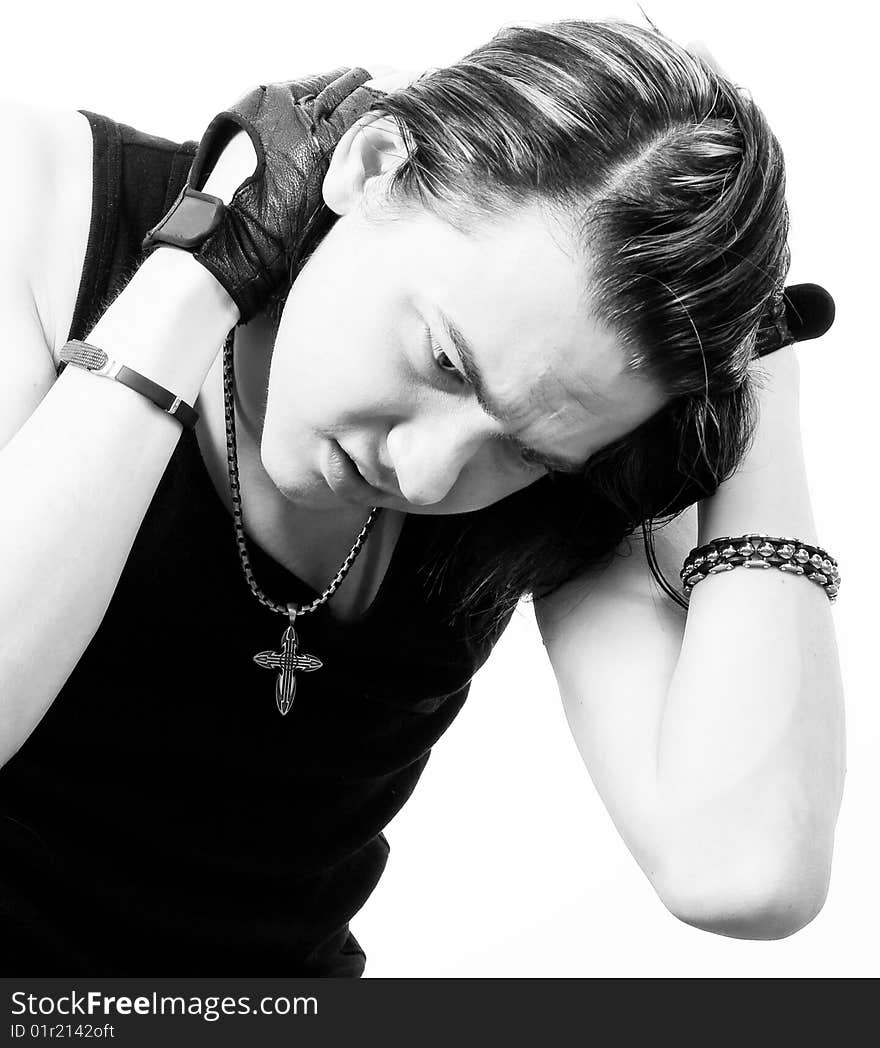 Black-and-white stylish studio portrait of long-haired young guy. Black-and-white stylish studio portrait of long-haired young guy