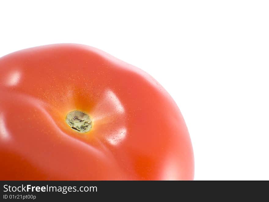 Part of a tomato isolated against a white background.