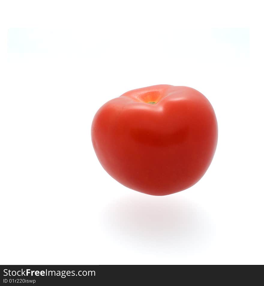 A tomato isolated against a white background.