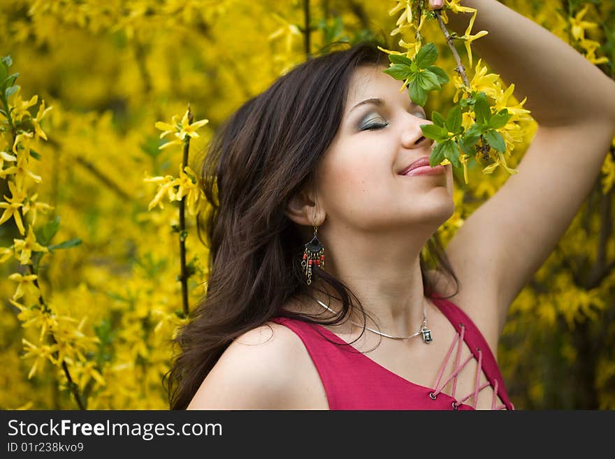 Woman in garden with yellow flowers