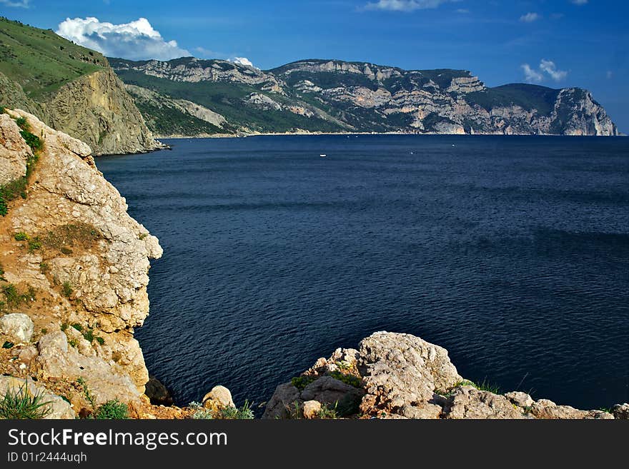 Seascape with rocks and moutaines