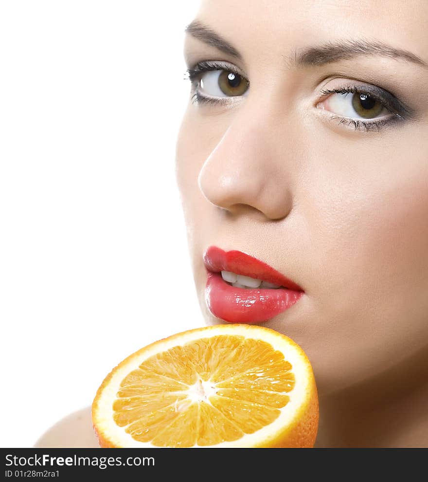 Closeup portrait of young woman  with half of orange. Closeup portrait of young woman  with half of orange