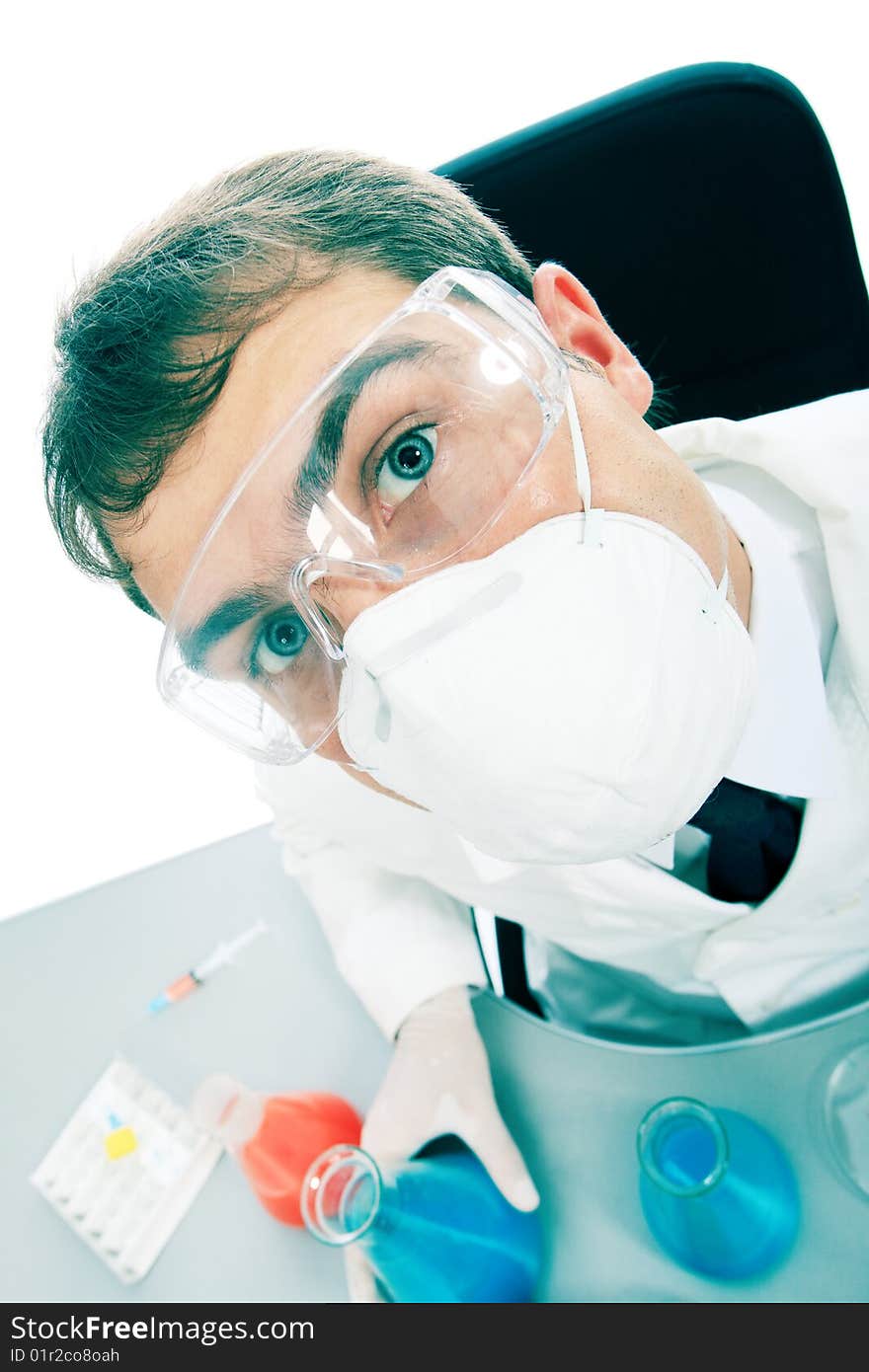 Medical theme: serious doctor working in a laboratory. Medical theme: serious doctor working in a laboratory.