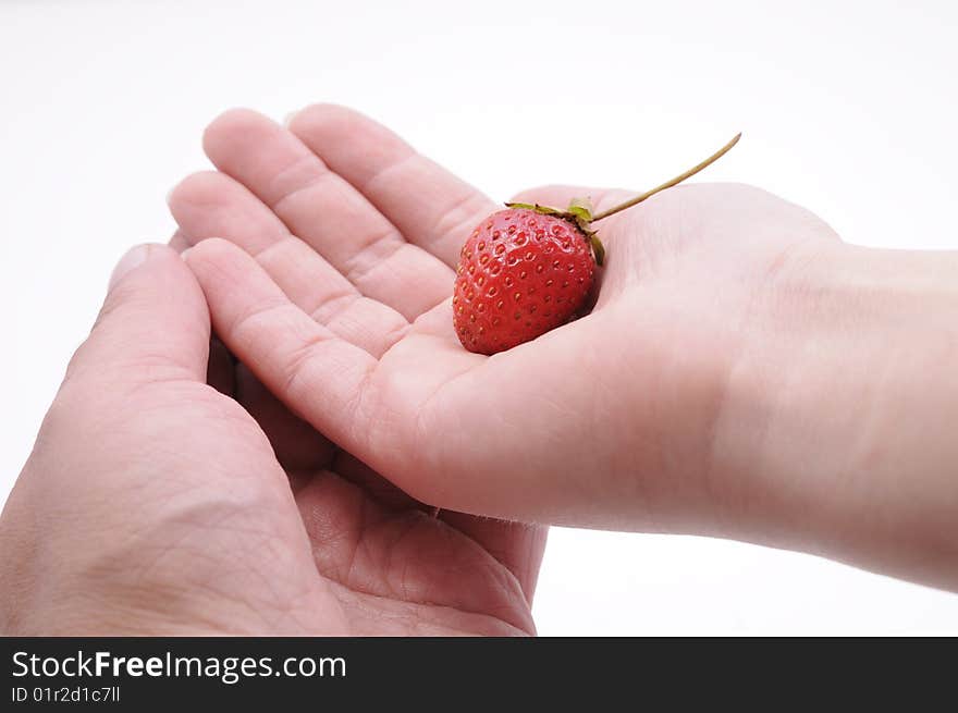 Hands of a couple with strawberry. Hands of a couple with strawberry