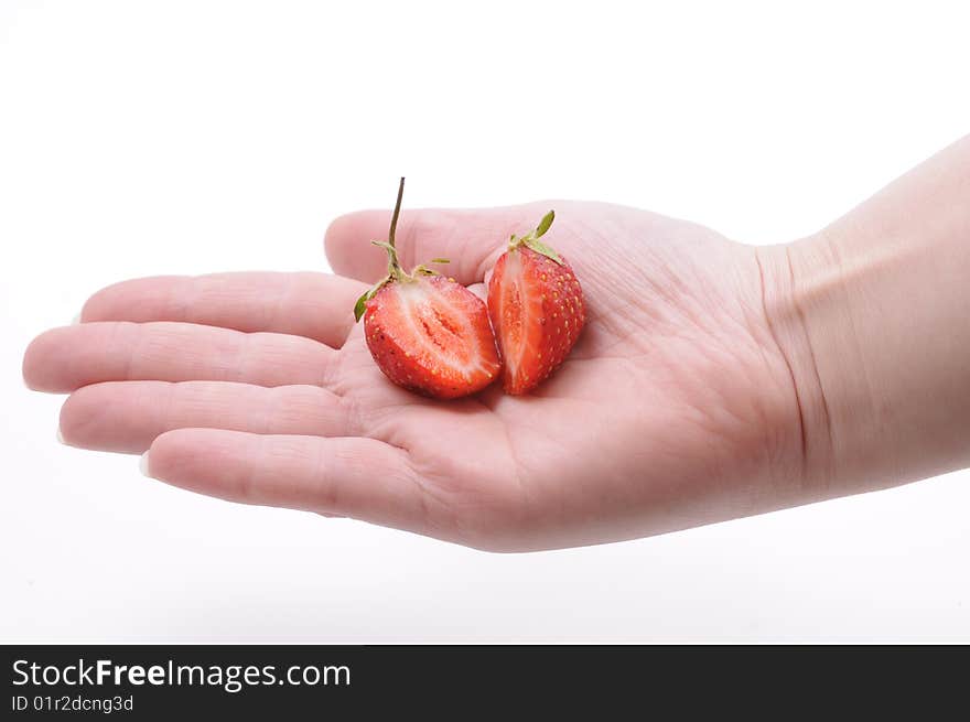 Girls hand with strawberry on white background. Girls hand with strawberry on white background