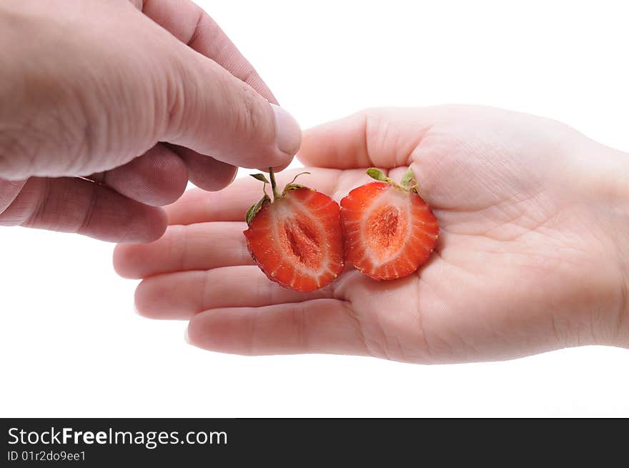 Hands of a couple with strawberry. Hands of a couple with strawberry