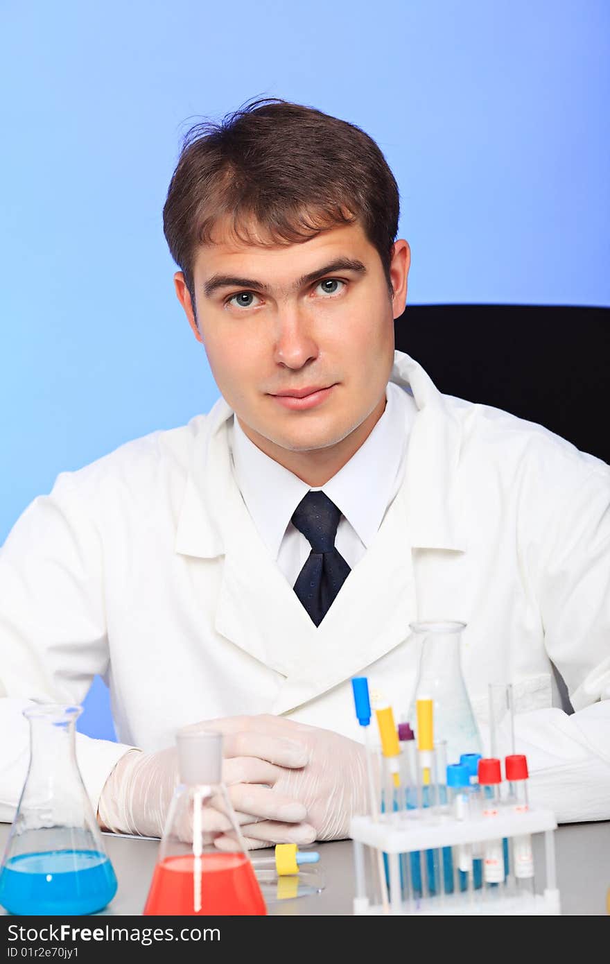 Medical theme: serious doctor working in a laboratory. Medical theme: serious doctor working in a laboratory.