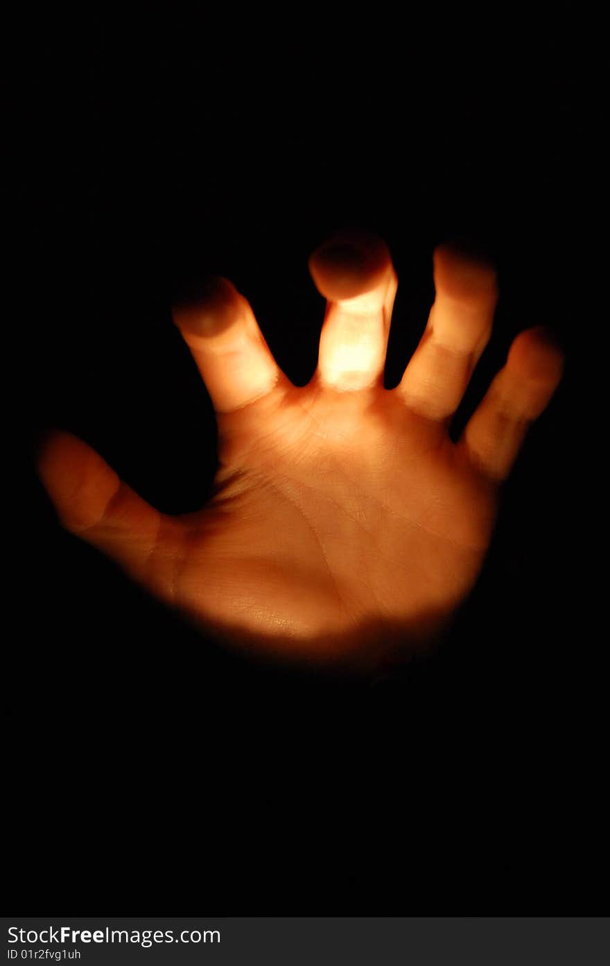 A opend hand comming out of the dark. A opend hand comming out of the dark