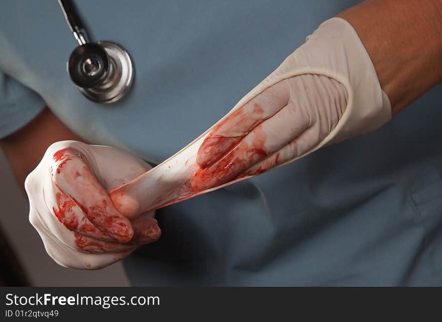 Abstract Of Doctors Bloody Surgical Gloves