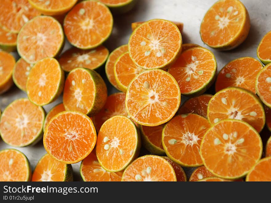 Sliced tangerines found at a fresh fruit market in Thailand. Sliced tangerines found at a fresh fruit market in Thailand