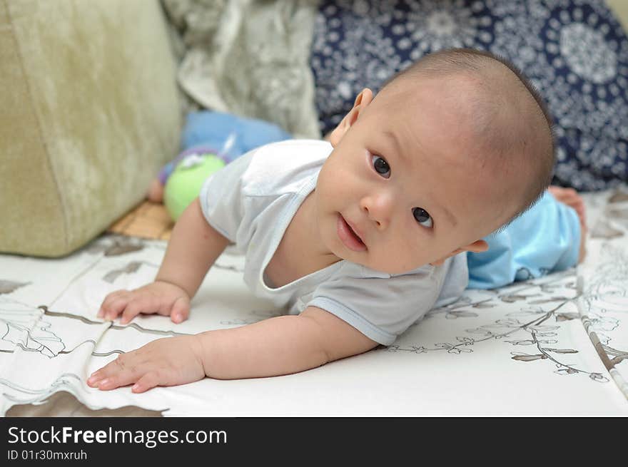 It is a cute chinese baby, isolated. he is 6 months. It is a cute chinese baby, isolated. he is 6 months.