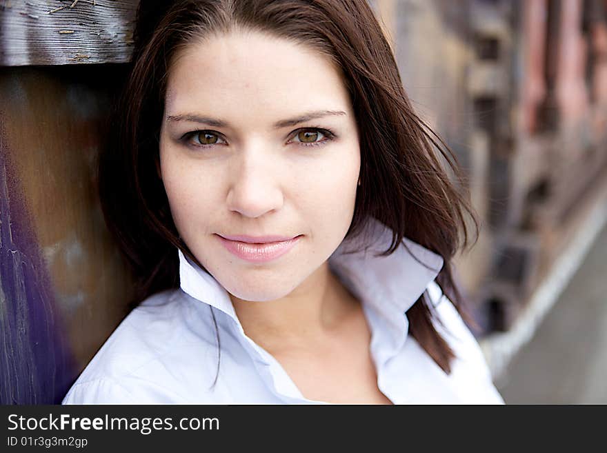 A Beautiful Brunette in a collared shirt with an edge