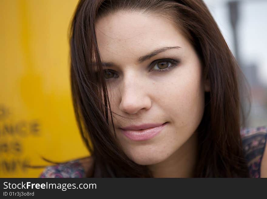 An Edgy Brunette with a yellow background. An Edgy Brunette with a yellow background