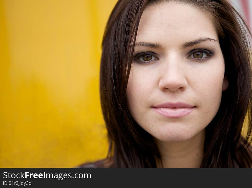 An Edgy Brunette with a yellow backround. An Edgy Brunette with a yellow backround