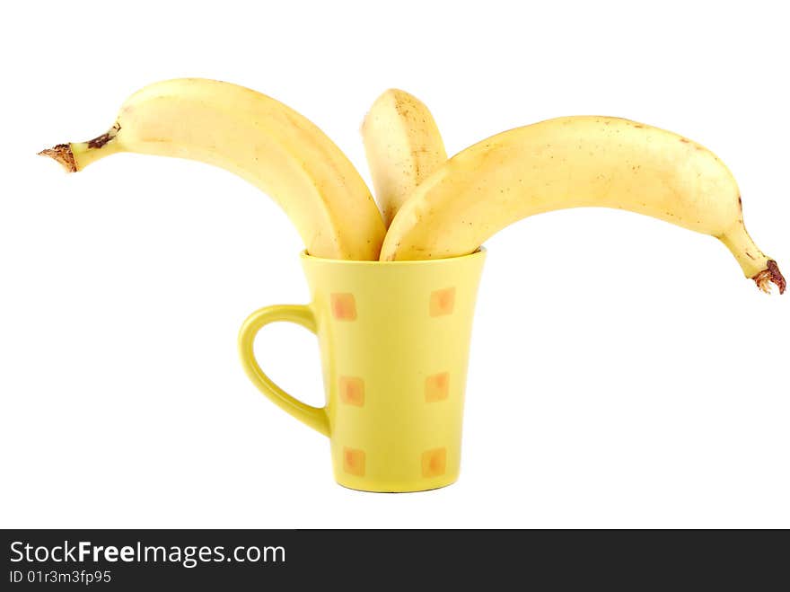 Yellow banana in a cup