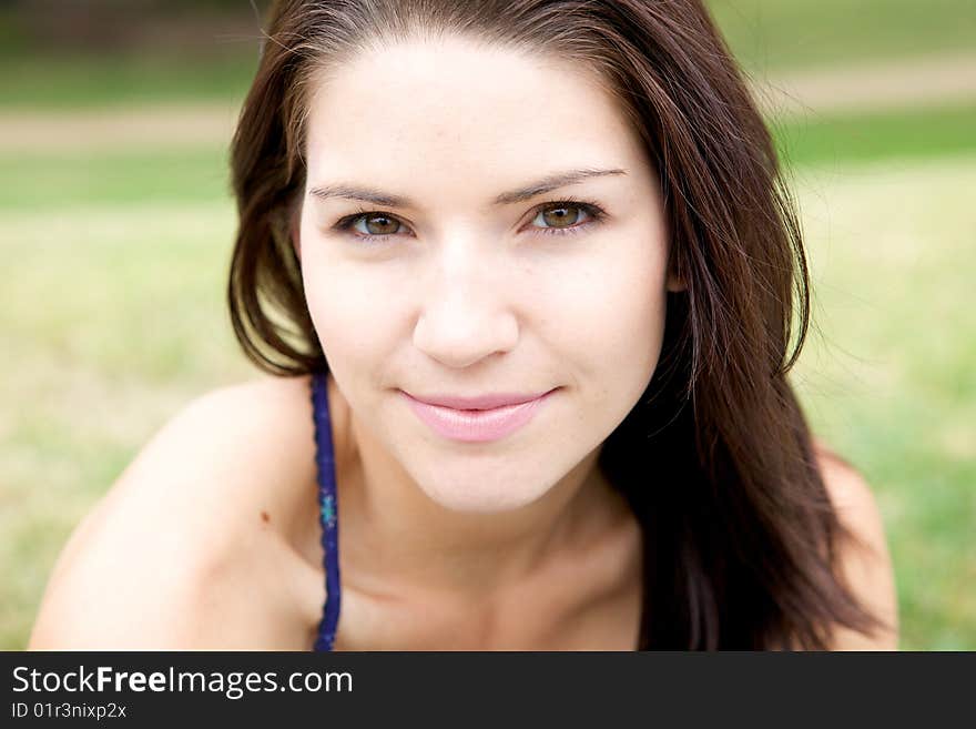 Fresh Faced Girl With Green Background