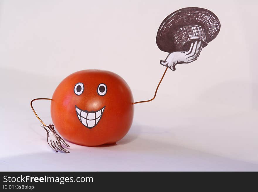 Tomato with a hat on a white background. Tomato with a hat on a white background