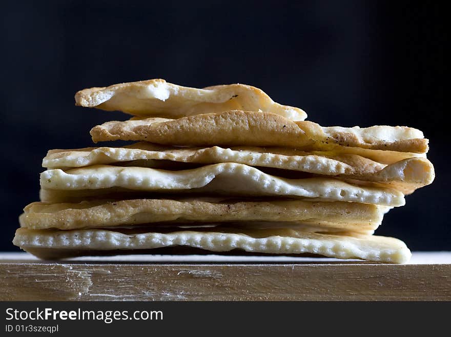 Photo of schiacciatine - italian bread over a black background