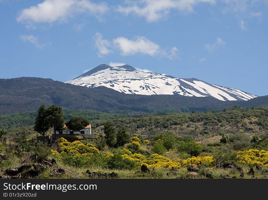 View at volcano Etna. House near volcano. View at volcano Etna. House near volcano.