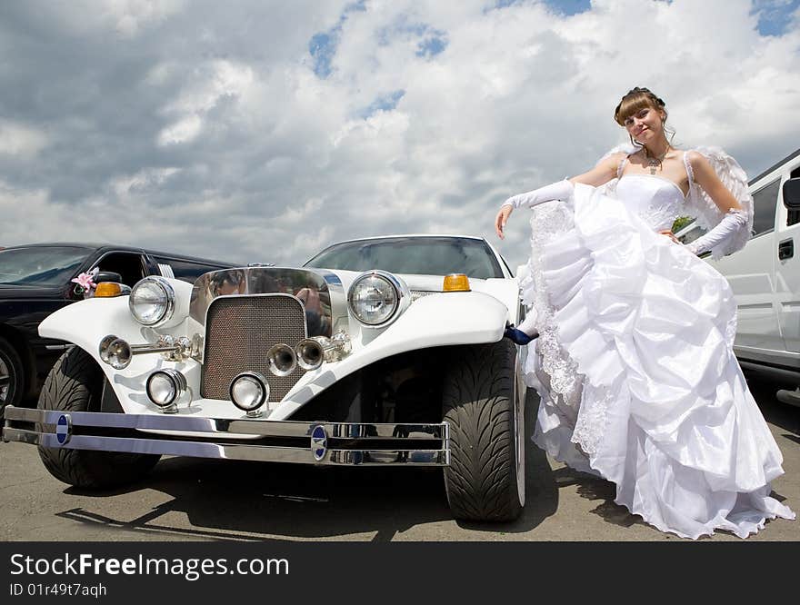 Beauty bride woman with limousine