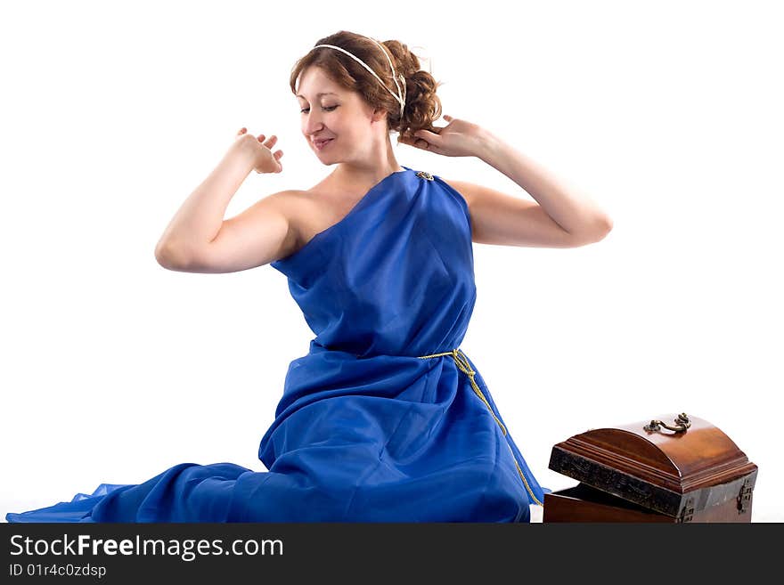 Lady in blue antique dress opening box on white background. Lady in blue antique dress opening box on white background