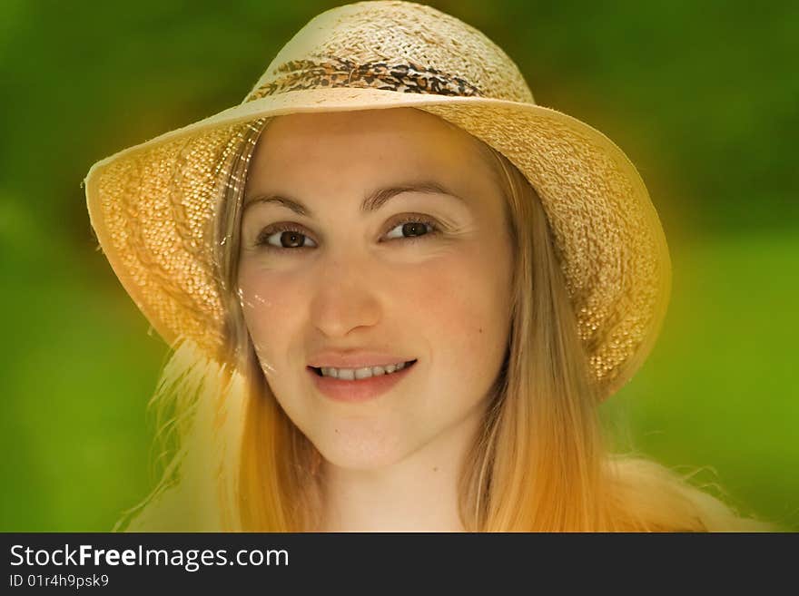 Portrait of smiling female wearing hat - summer scene. Portrait of smiling female wearing hat - summer scene