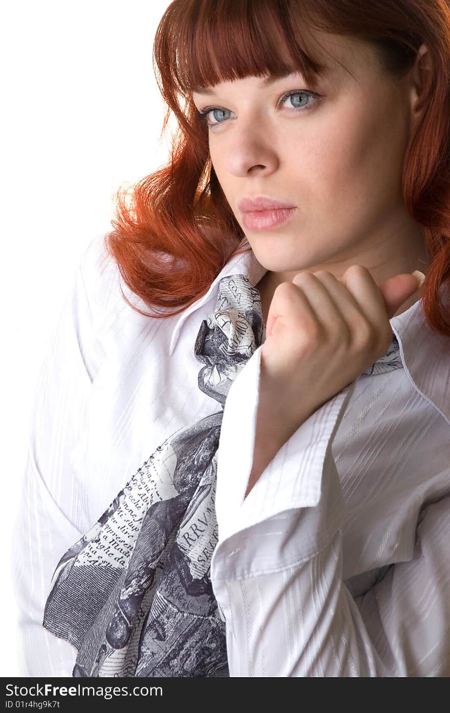 Red haired woman wearing a blouse and a scarf close-up