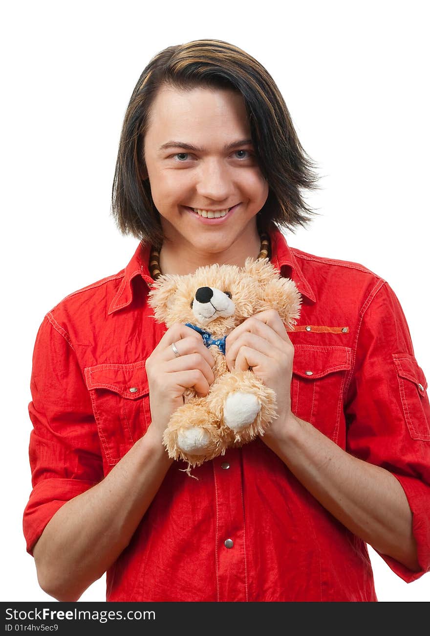 Young guy with his loved  from childhood toy - teddy bear. Isolated over white in studio. Young guy with his loved  from childhood toy - teddy bear. Isolated over white in studio.