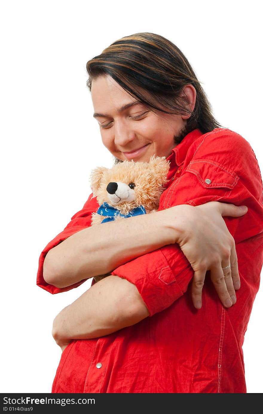 Young guy with his loved  from childhood toy - teddy bear. Isolated over white in studio. Young guy with his loved  from childhood toy - teddy bear. Isolated over white in studio.