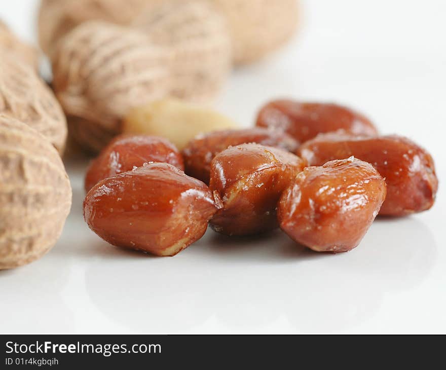 Macro of nuts and peanuts in white background