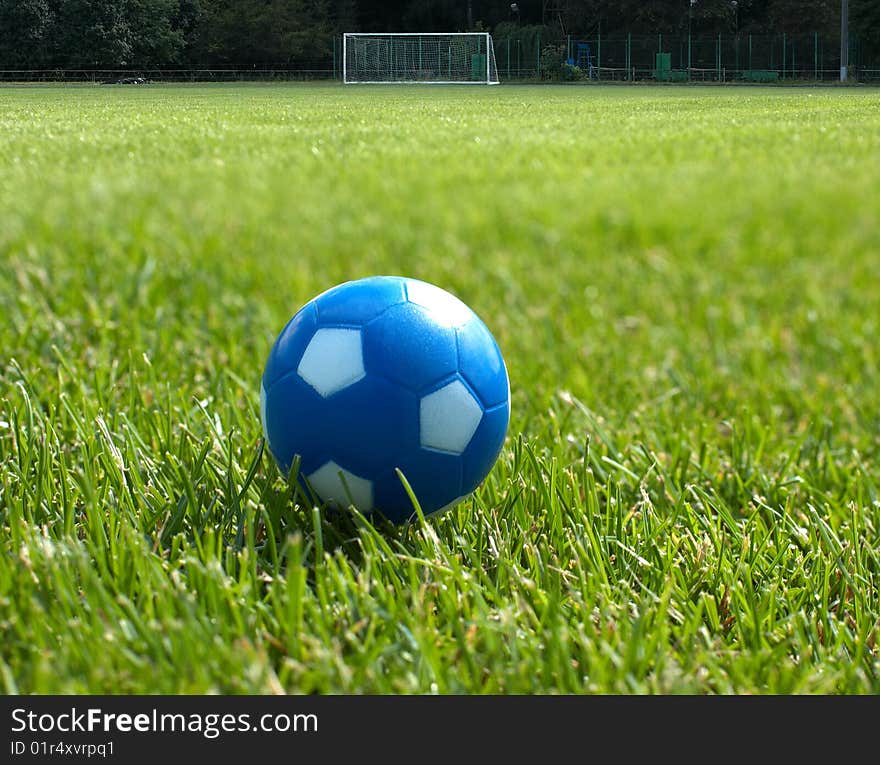 Small Blue Soccer Ball Against Goal