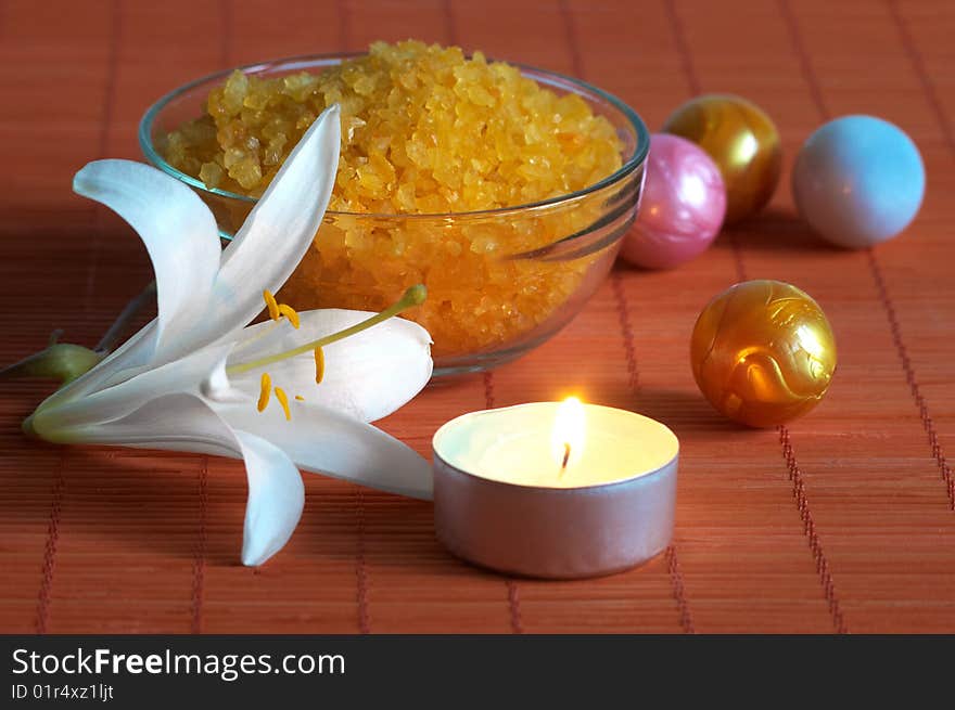 Bath salt and lily on bamboo mat