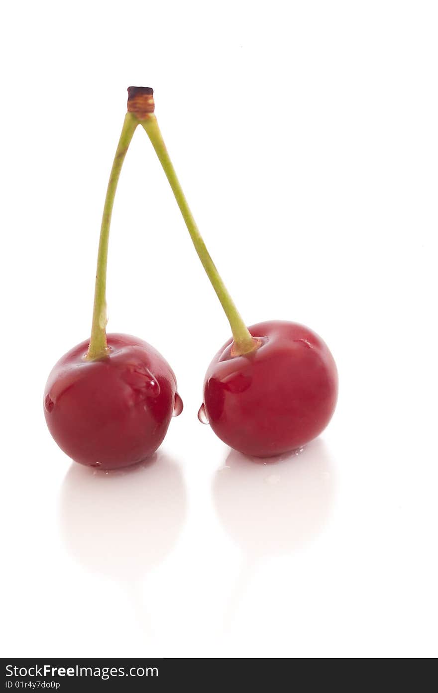 Red riped cherry on white background