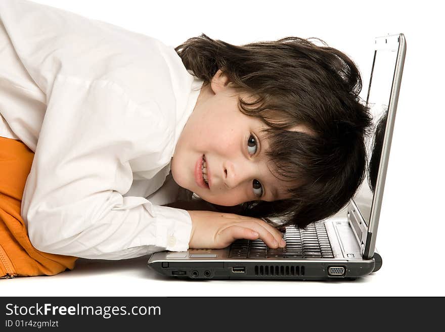 The merry boy with laptop on white background