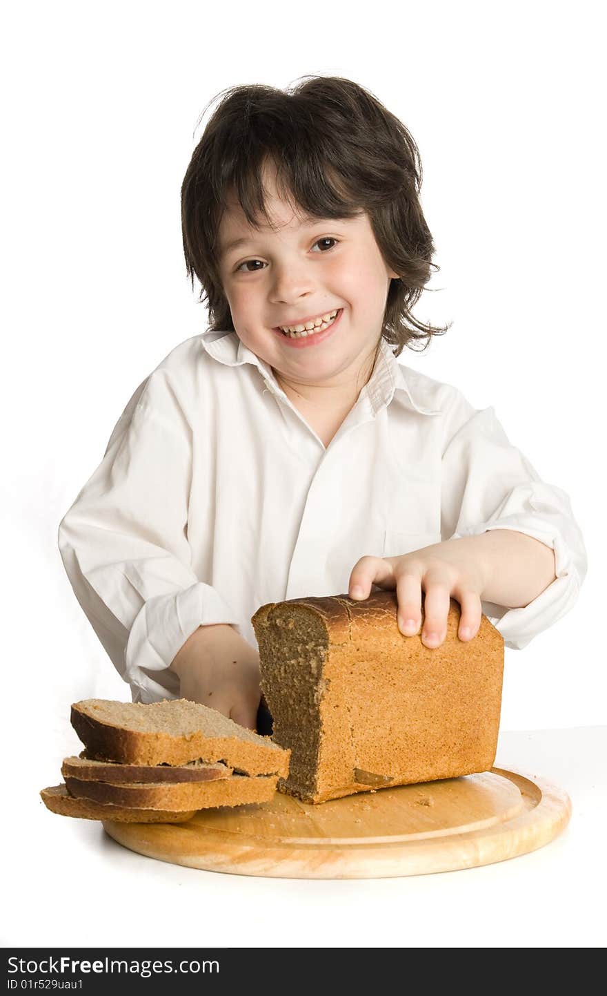 The Liitle Boy Wich Slicing A Bread On Desk